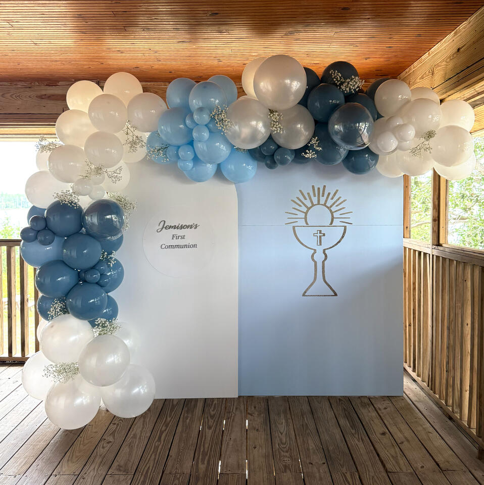 First Communion Organic Balloon Garland with Custom Backdrops organic balloon garland in blues and white with two arch backdrops and custom graphics