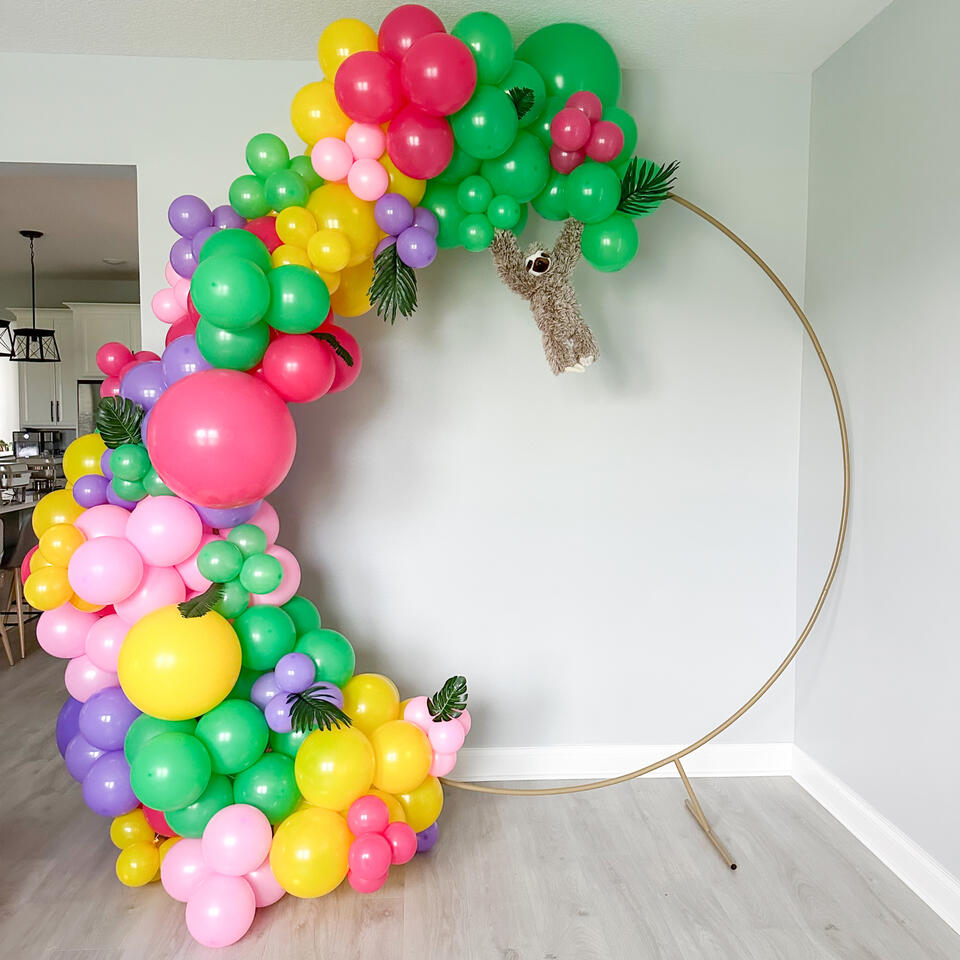 Let's Hang Half Hoop balloon hoop with bright colors and sloth props