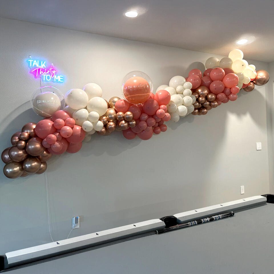 Talk Thirty to Me organic twelve foot balloon garland with clear bubble balloons and lighting