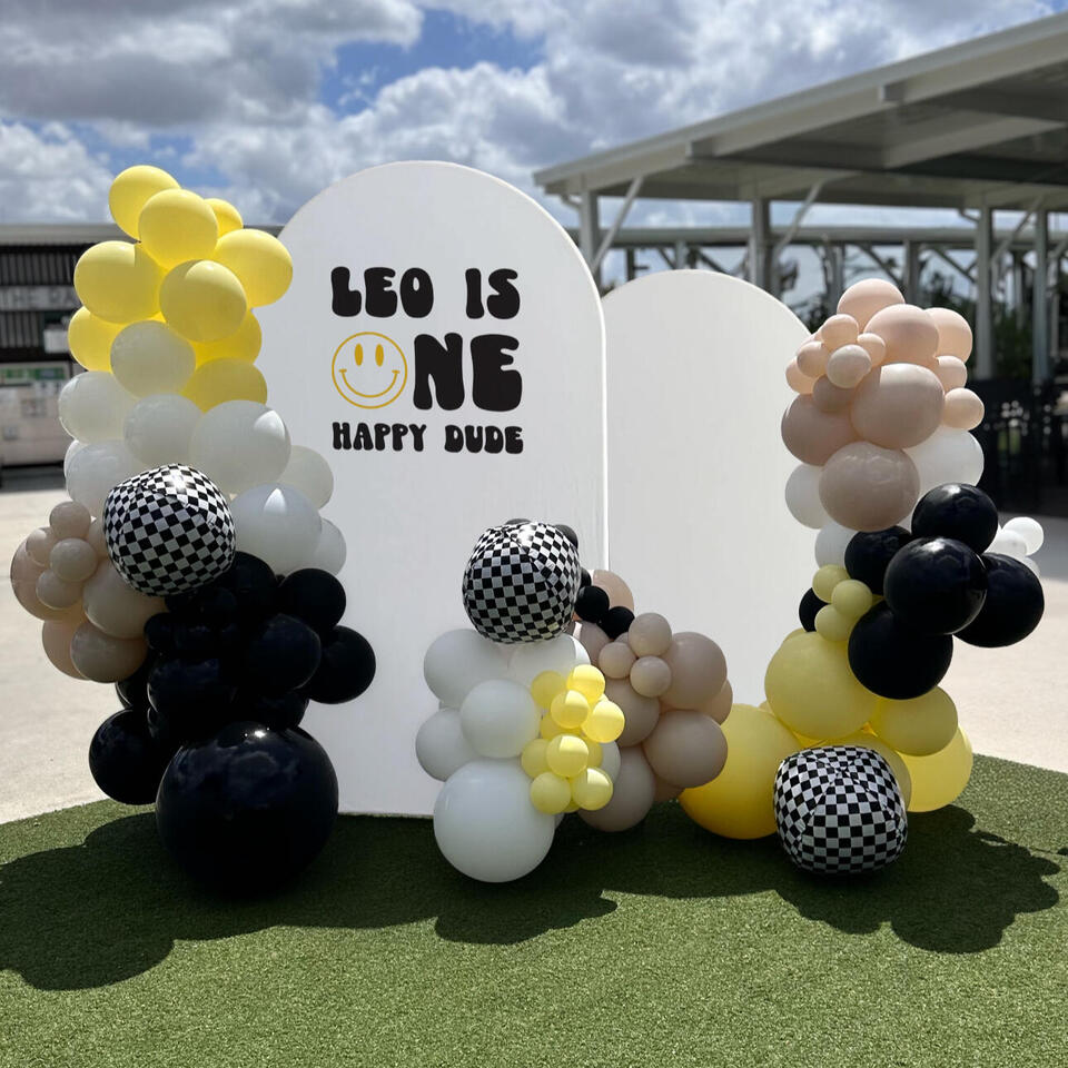 organic balloon garland with foils in a first birthday party theme