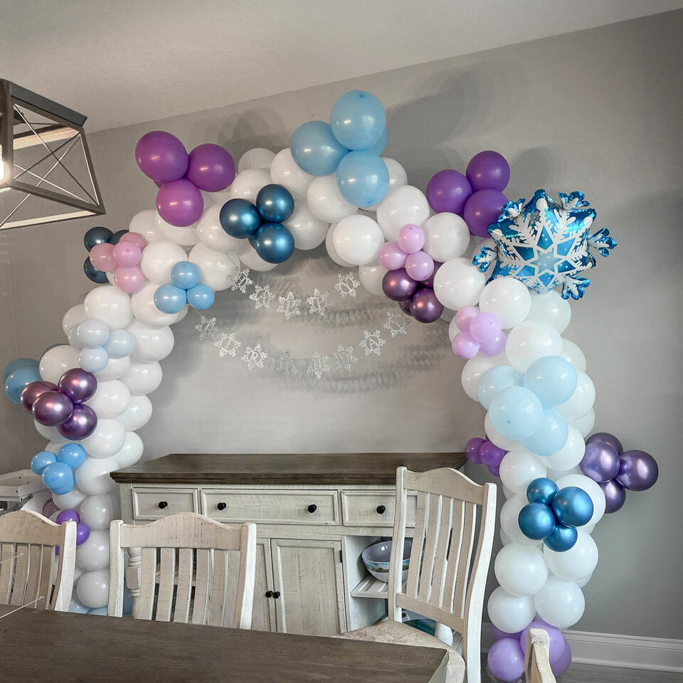 balloon arch with snowflake accents