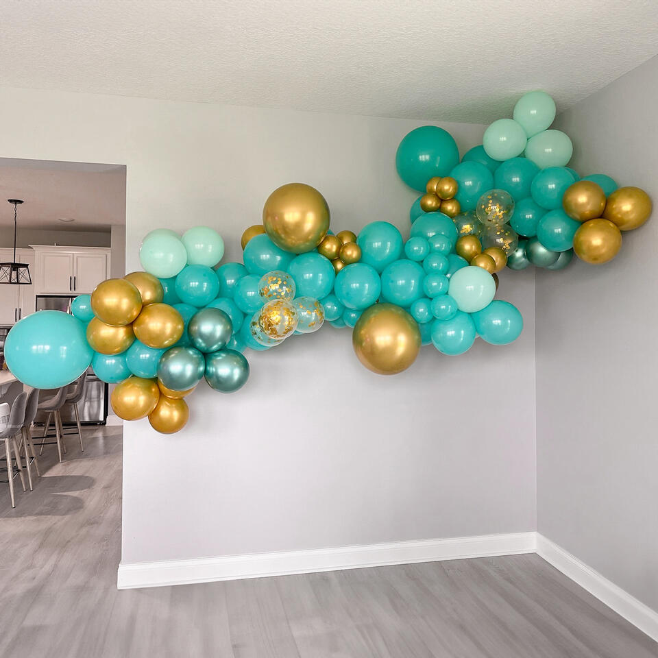 organic balloon garland in teal with gold accents